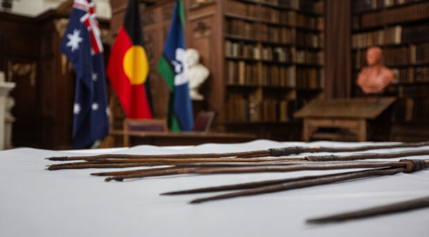 The Gweagal spears presented on a table at the ceremony in the Wren Library.