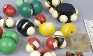 A set of molecular models, balls joined together with bright colours