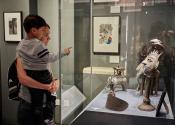 visitor and child exploring the displays 
