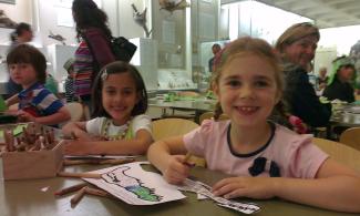 Children smiling, doing crafts 