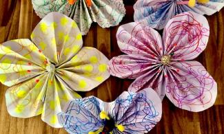 5 large flowers made out of paper