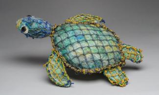 Turtle sculpture made from fishing nets
