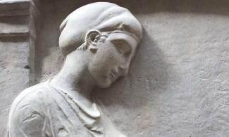 plaster cast of a Greek grave monument showing a young woman