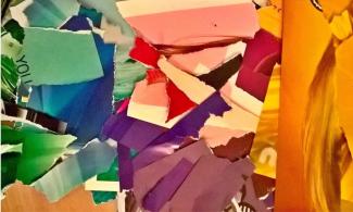 Torn bits of different types and colours of paper laid in a pile