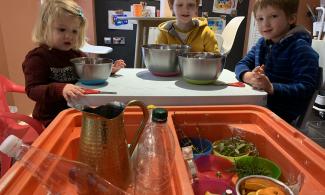 Children making perfume with citris, mint and lavender