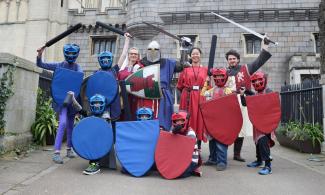 A group of adults and children dressed up as Knights