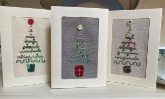 a hand embroidered Christmas tree card