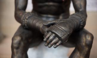 Close up of the Terme Boxer's hands in their boxing gloves