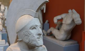 Statue of a smiling Greek soldier