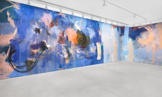 A photograph of the gallery space containing a large scale painting by Megan Rooney. 