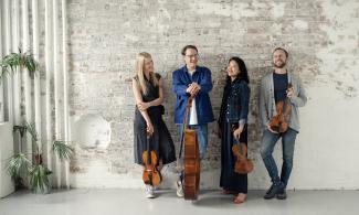 a group of musicians holding string instruments