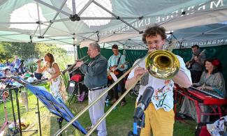 Under a marquee, a band and singer perform in the Garden.