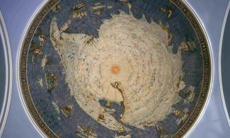 alt="the image shows a map of the Antarctic, surrounded by ships and the names of famous Antarctic explorers"