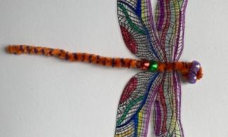 Pipe cleaner dragonfly with stained glass inspired wings 