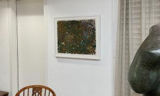 A corner of the Kettle's Yard house, with an abstract painting by Gillian Ayres hung on the wall.