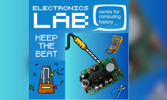 The image shows a standard metronome and a soldering iron being used to build a digital one.