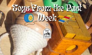 Background shows a spinning top and wooden toys. Foreground reads Toys from the Past week and shows the Denny Abbey and the Farmland Museum logo.