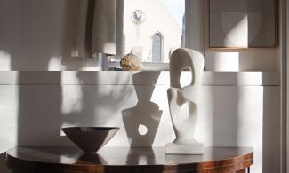 A table in the Kettle's Yard house with a marble sculpture by Kenji Umeda.