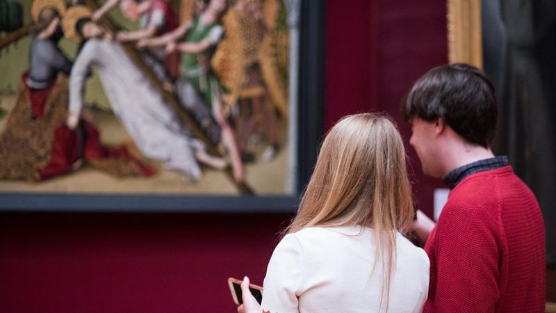 Visitors looking at art