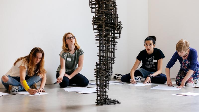 Students drawing an Antony Gormley at Kettle's Yard