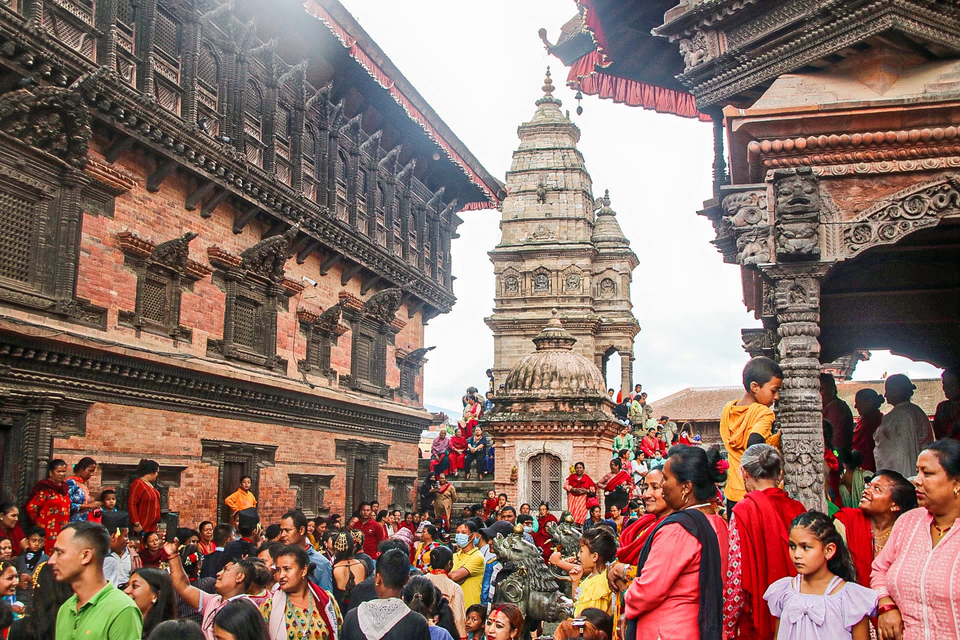We see people gathered around the temples clustered in one section of the Durbar Square.They have occupied every accessible part of the temples that are built wooden, brick and stone. 