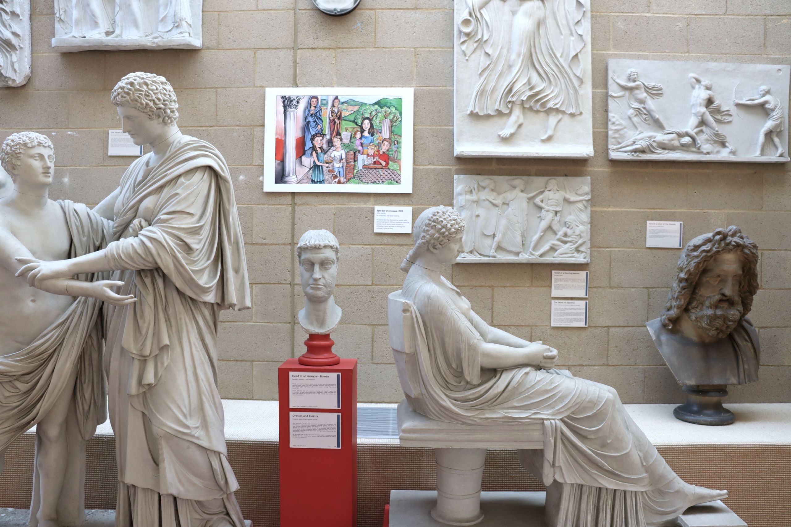Photograph of the artwork 'Open Day at Aeclanum' completely surrounded by casts.