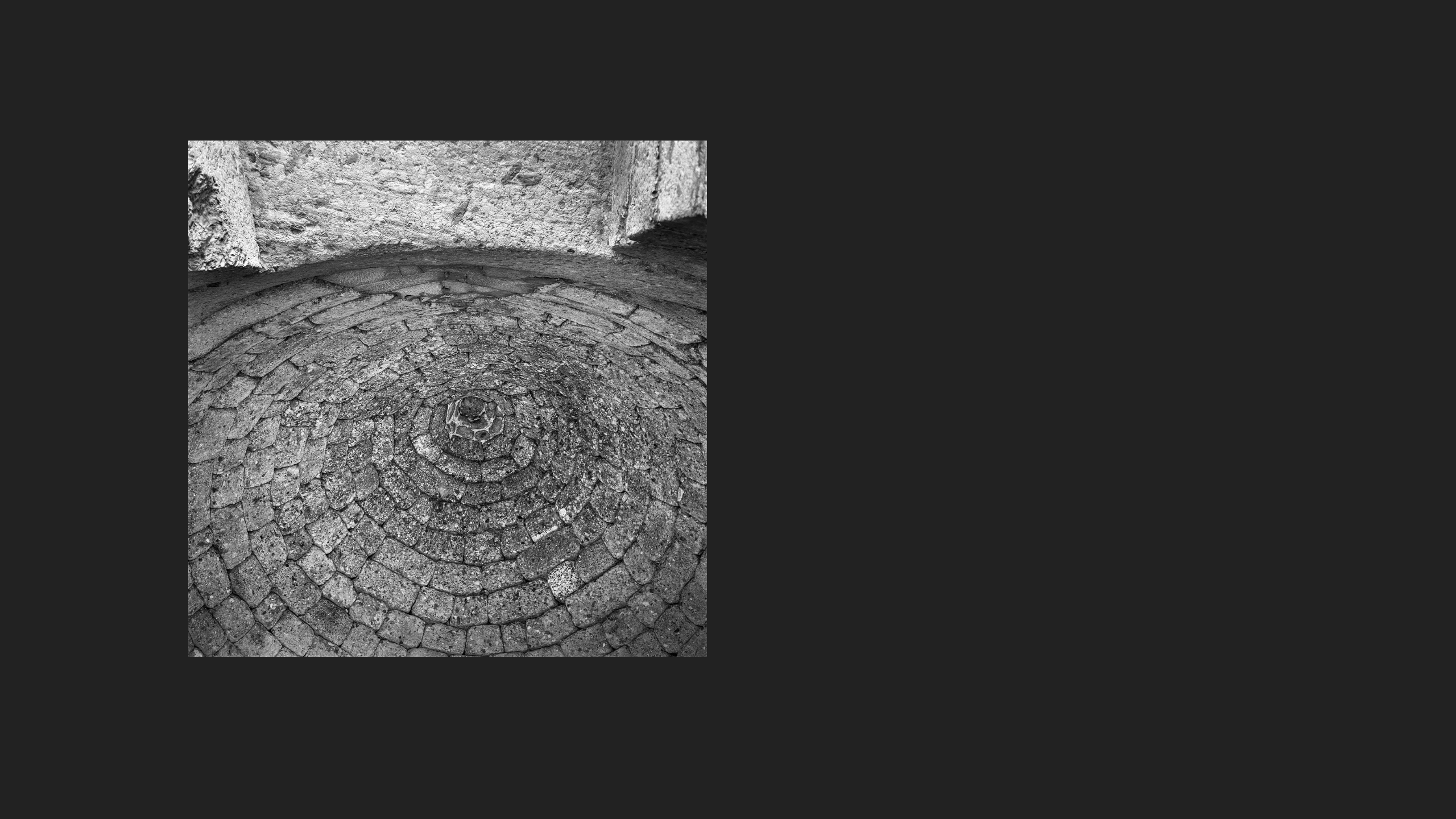Ancient floor bricks laid in a spiral pattern