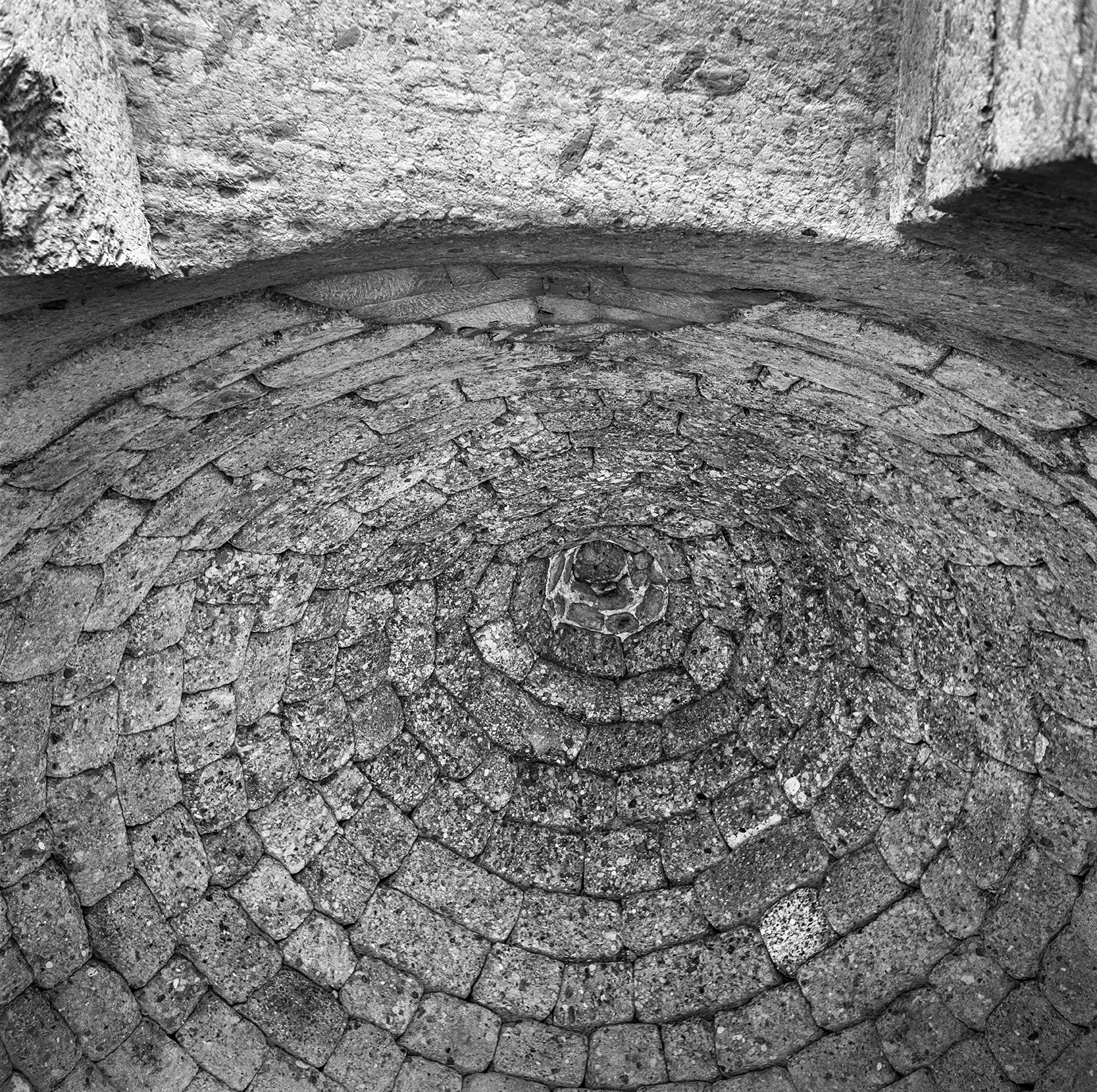 Ancient floor bricks laid in a spiral pattern