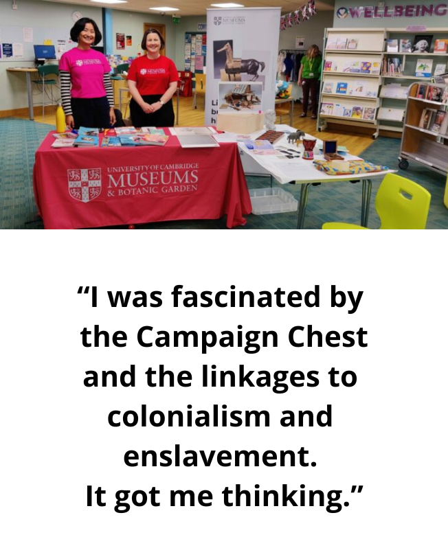 An image of two staff members in front of a table filled with objects and dressed with a University of Cambridge Museums tablecloth. “I was fascinated by the Campaign Chest and the linkages to colonialism and enslavement. It got me thinking."