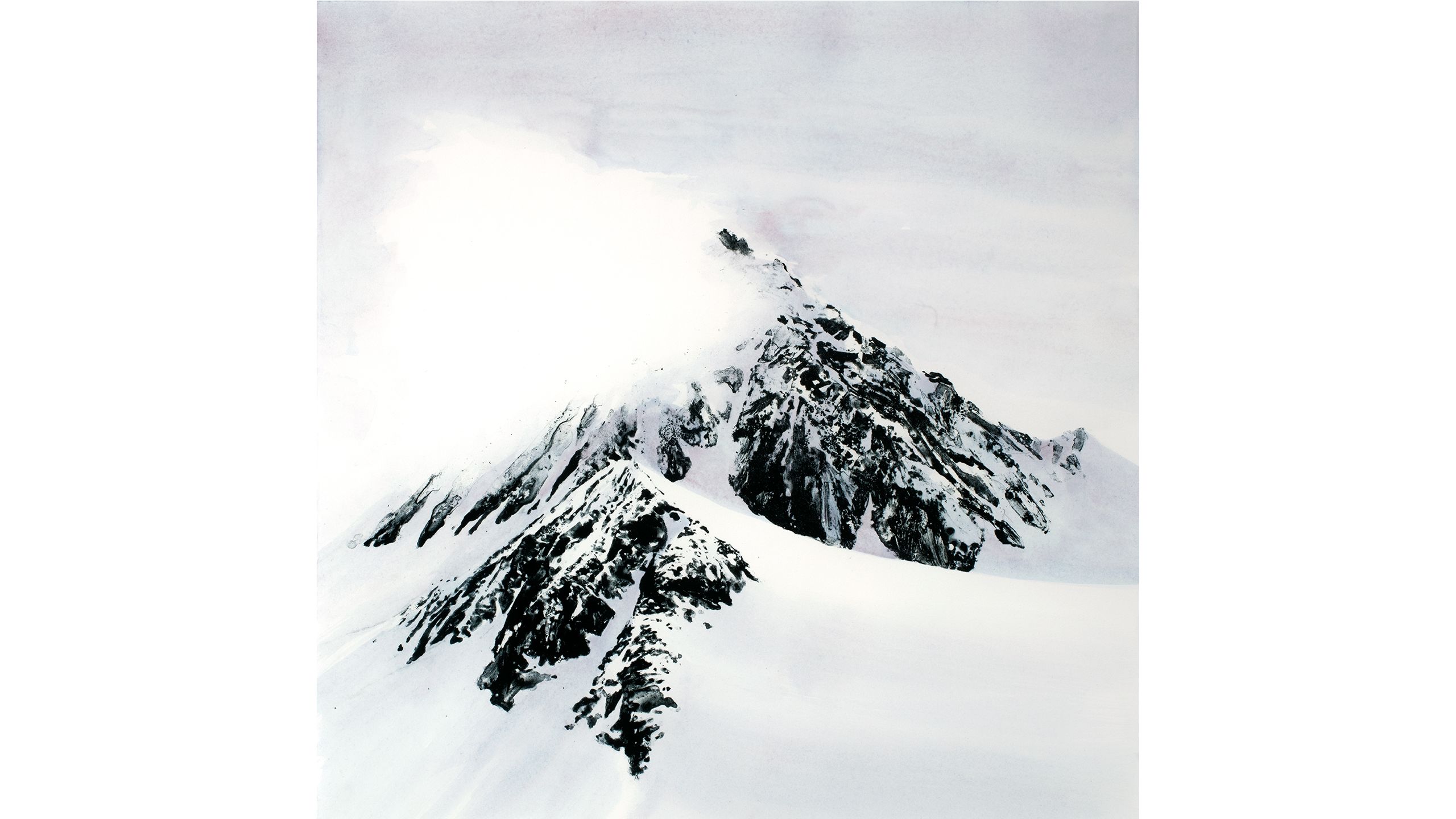 In ice covered mountain is partially obscured by cloud.