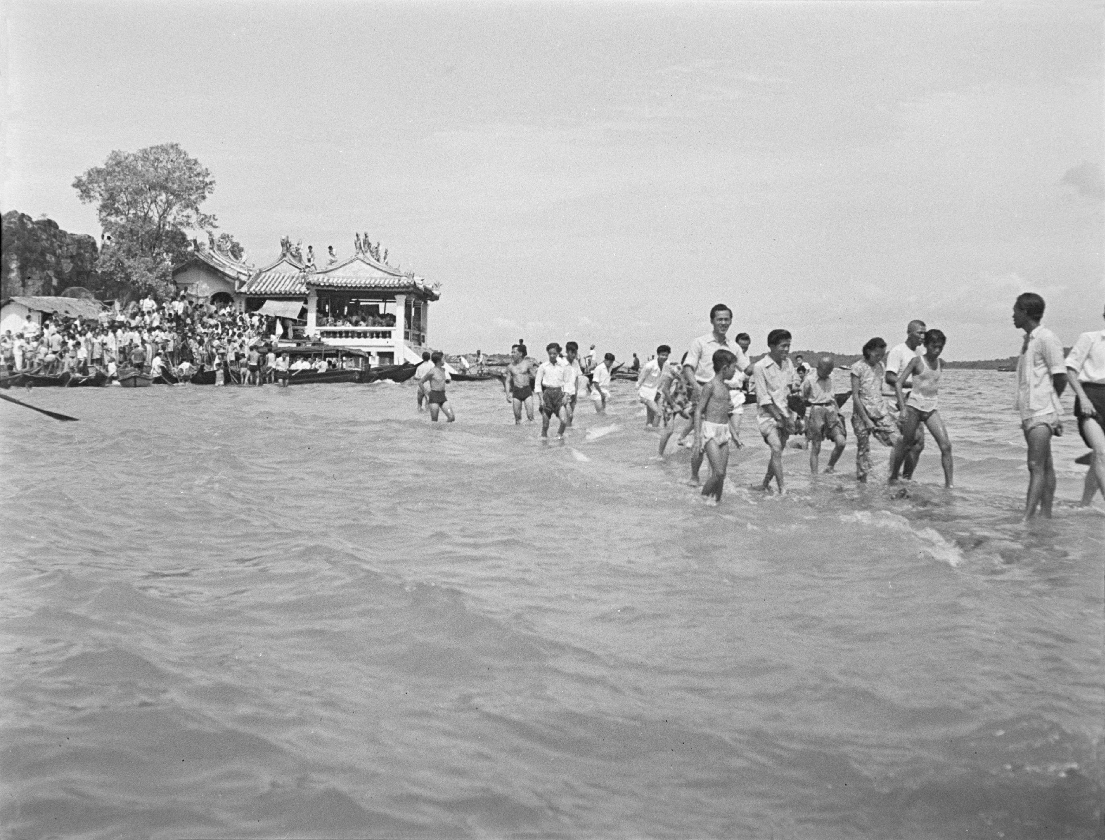 Pilgrims in the sea by Kusu Island.