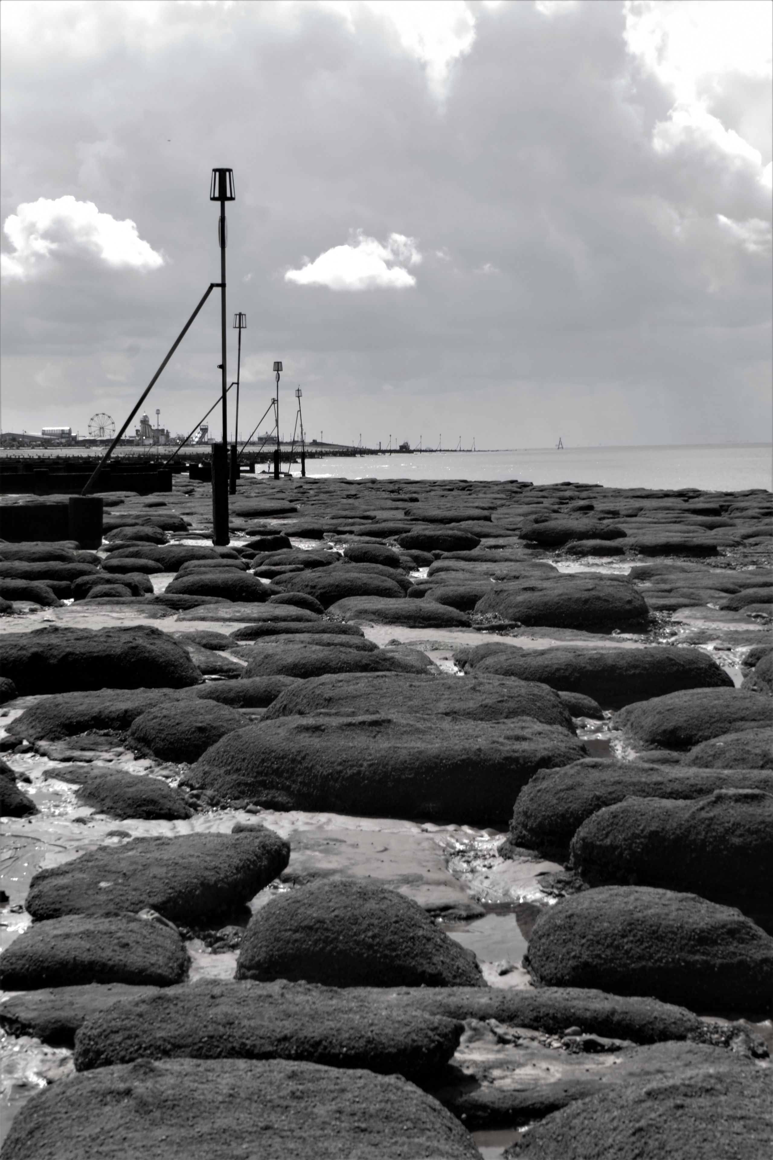 stones on a beach, greyscale