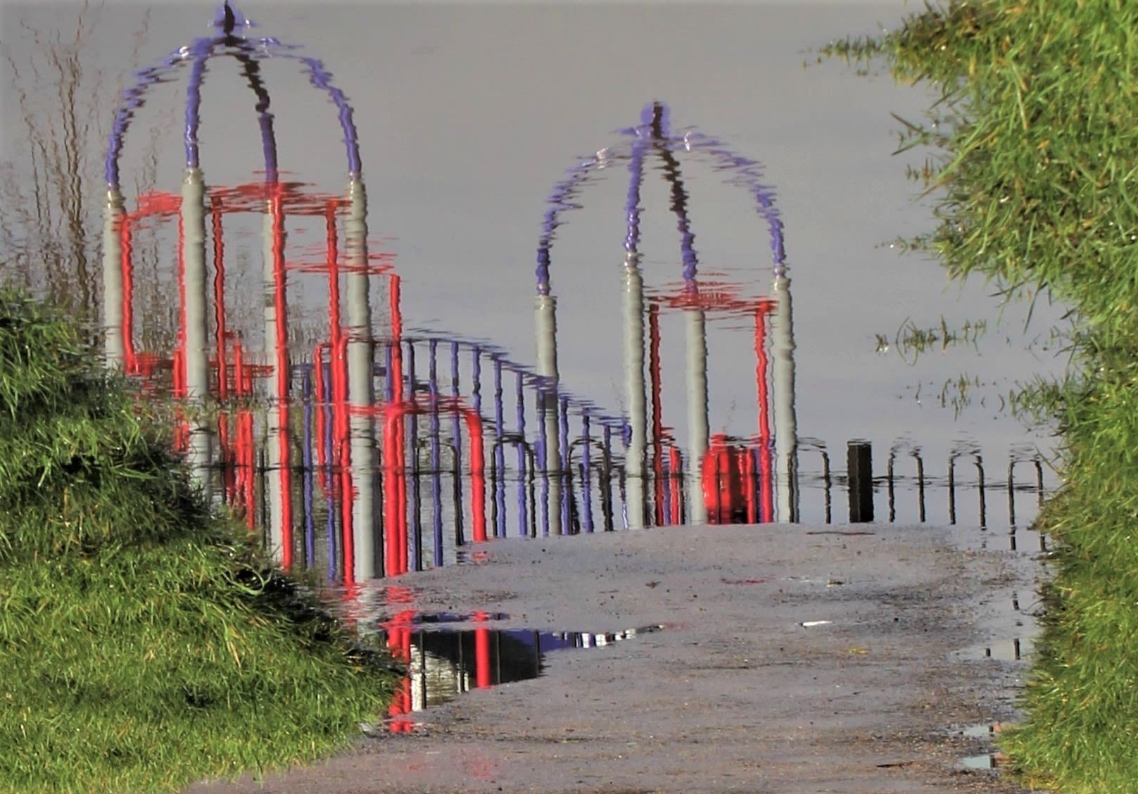 blurred view of colourful gates and fences